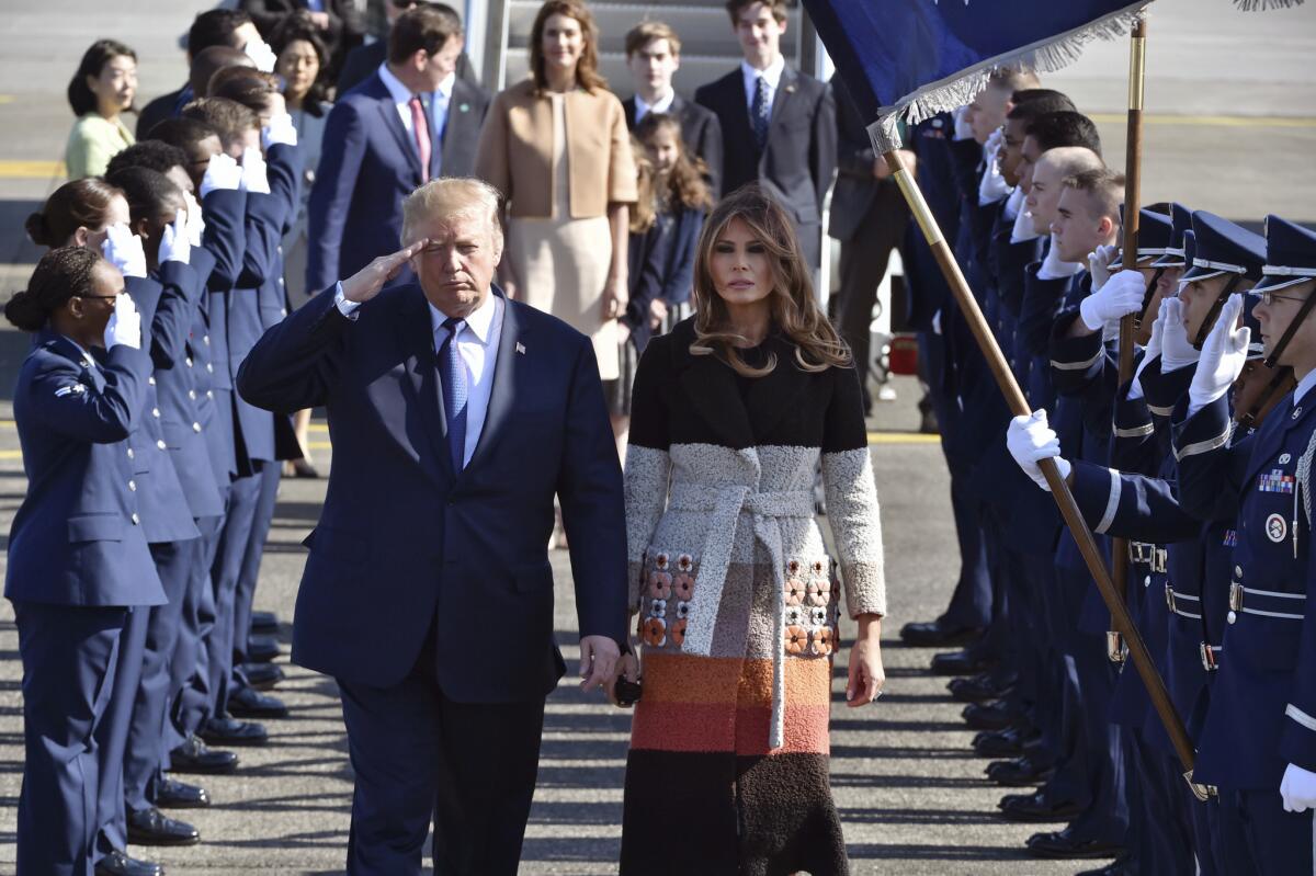 President Trump and First Lady Melania Trump arrive at Yokota Air Base on the outskirts of Tokyo on Sunday.