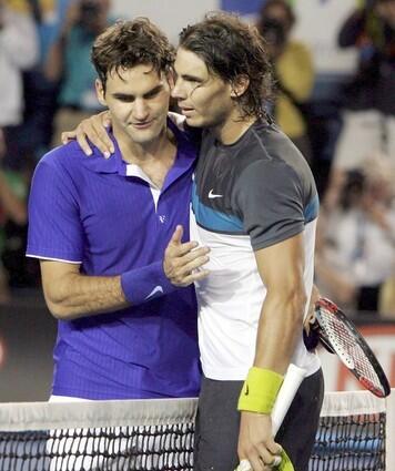 Roger Federer congratulates Rafael Nadal after he won the Australian Open with a five-set victory on Sunday.