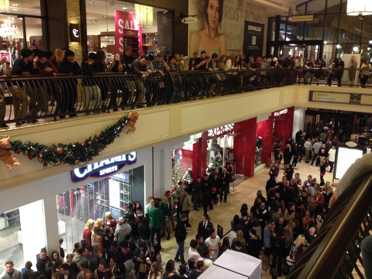 Hundreds of shoppers wait for Urban Outfitters to open at midnight at the Oaks shopping mall in Thousand Oaks.