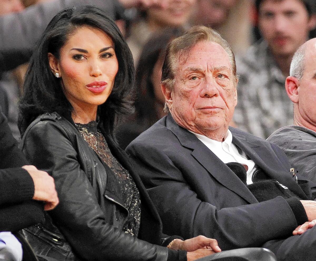 Los Angeles Clippers owner Donald Sterling, seen above with V. Stiviano, was fined $2.5 million by the NBA and banned for life from the league after it concluded that the voice on a recording that said racially charged comments was his.