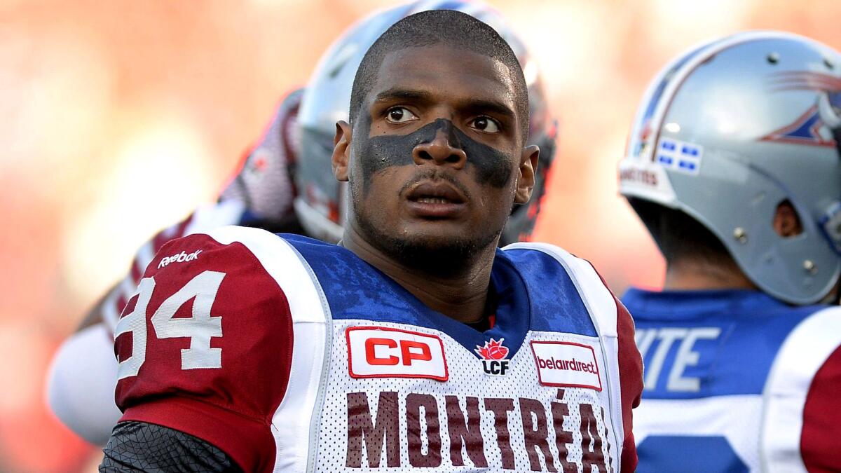 Michael Sam joins Alouettes teammates during warmups for a game against Ottawa on Aug. 7.