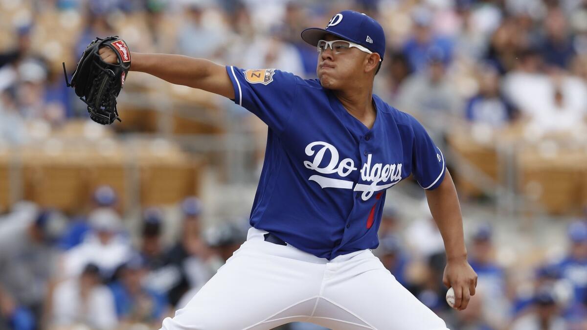 The Dodgers' Julio Urias pitches against Seattle during a spring training game on March 5 at Camelback Ranch.