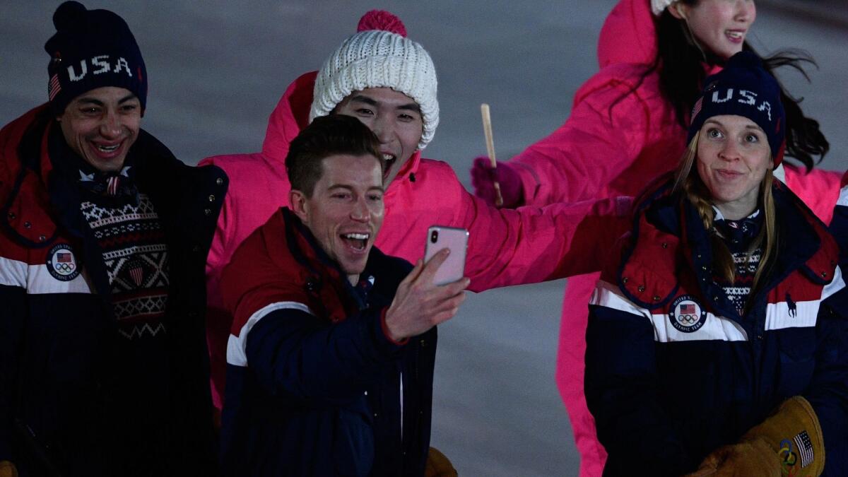 Shaun White takes a selfie with his compatriots during the opening ceremony of the 2018 Winter Games.