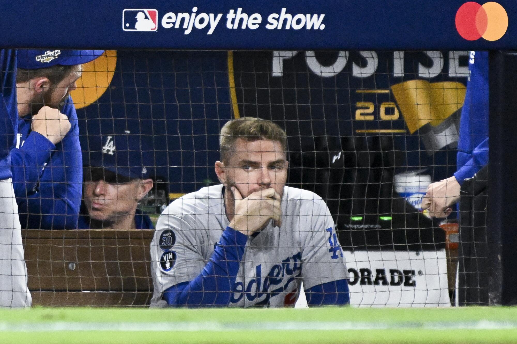 Dodgers first baseman Freddie Freeman watches from the dugout during the eighth inning in Game 3 of the NLDS.