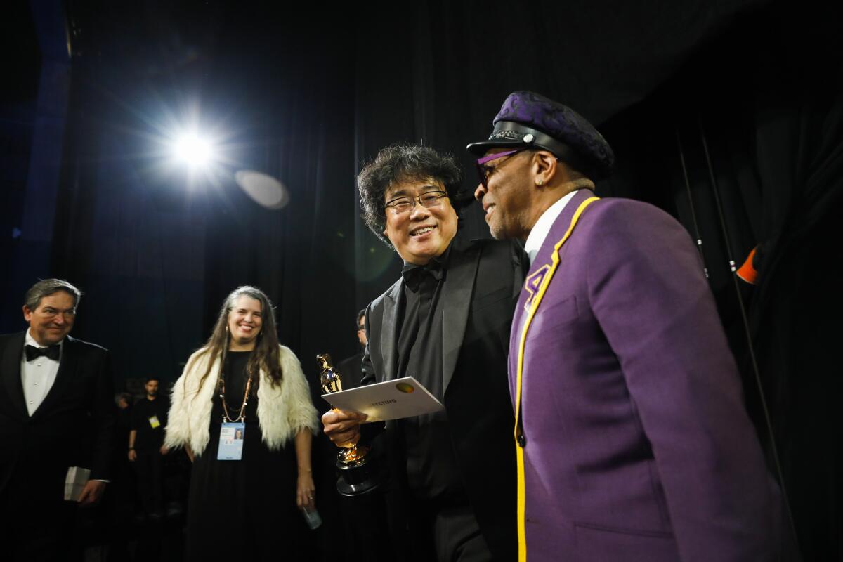 Bong Joon Ho, after his victory for best director for “Parasite,” with Spike Lee backstage at the 92nd Academy Awards.