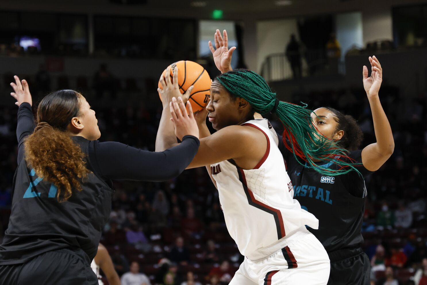 South Carolina head coach Dawn Staley, center, Lisa Boyer, and