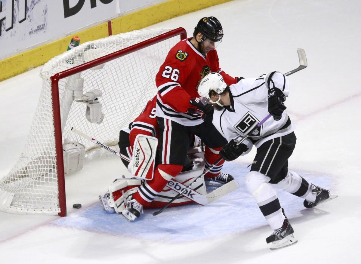 Kings right wing Justin Williams scores past Chicago center Michal Handzus (26) and goalie Corey Crawford during Game 2 of the Western Conference finals on May 21.