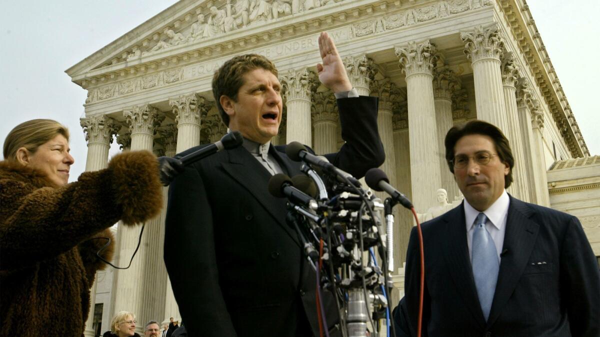 Jay Sekulow, right, listens as his client Randall Terry, founder of the antiabortion group Operation Rescue, talks to reporters outside the Supreme Court in 2002.