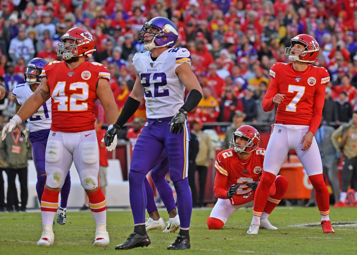 Anthony Sherman (42), Harrison Smith (22), Dustin Colquitt (2) and Harrison Butker (7) watch as Butker's 54-yard field goal attempt sails through the uprights to give the Kansas City Chiefs a win over the Minnesota Vikings.