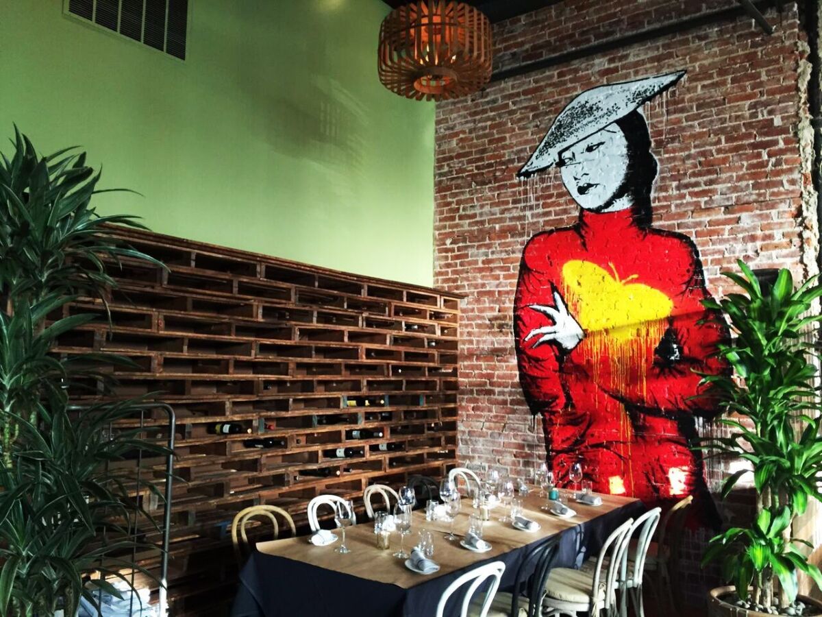 Colorful murals line the original brick walls of Sovereign Restaurant in the Gaslamp Quarter. — Pam Kragen