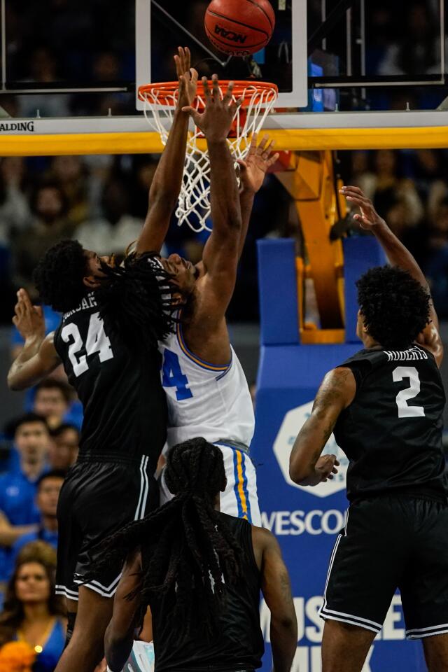UCLA forward Jalen Hill (24) goes up for a layup against Long Beach State center Joshua Morgan (24) during the first half of a game Nov. 6 at Pauley Pavilion.