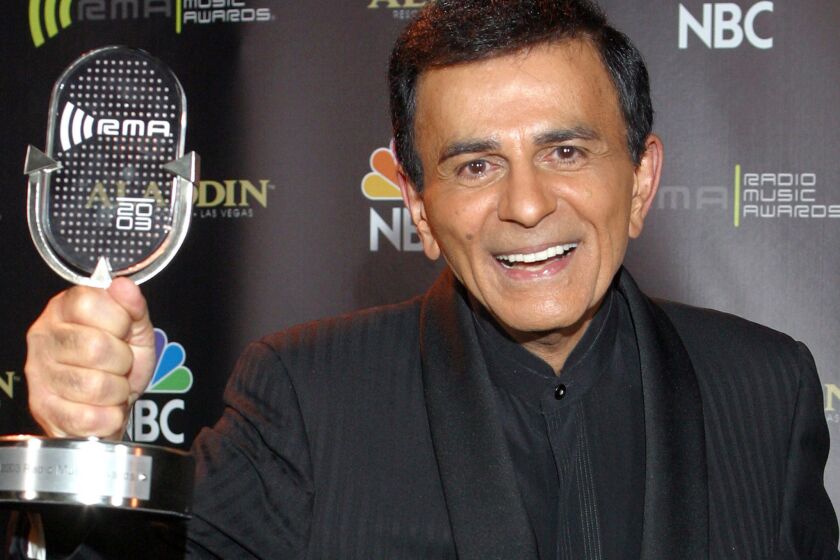 Casey Kasem poses for photographers after receiving the Radio Icon award during the 2003 Radio Music Awards. Kasem died Sunday at age 82.