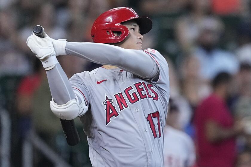 Los Angeles Angels designated hitter Shohei Ohtani watches his double off Houston Astros.