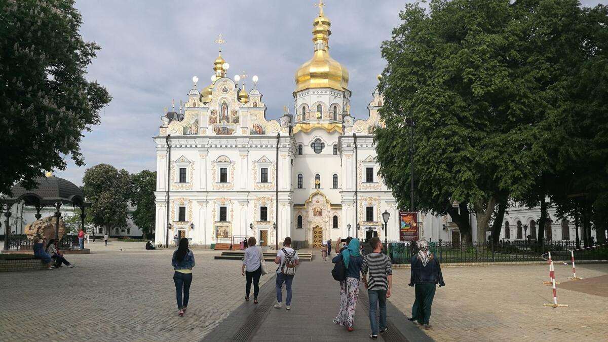 Believers and visitors on the way to the Great Church of the Kiev-Pecherska Lavra, an Orthodox Christian complex in Kiev, Ukraine, founded in 1051.