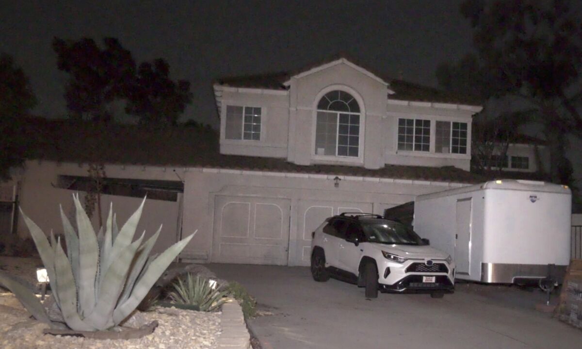 A house with a car in the driveway