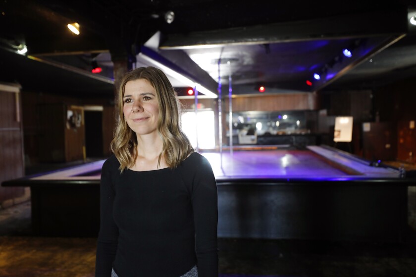 Kristen Zimmermann, executive director of the Freedom Center, stands in the former Body Shop strip club.