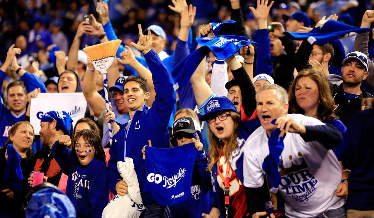 Royals fans celebrate after sweeping the Angels in a best-of-five American League division series on Sunday in Kansas City.