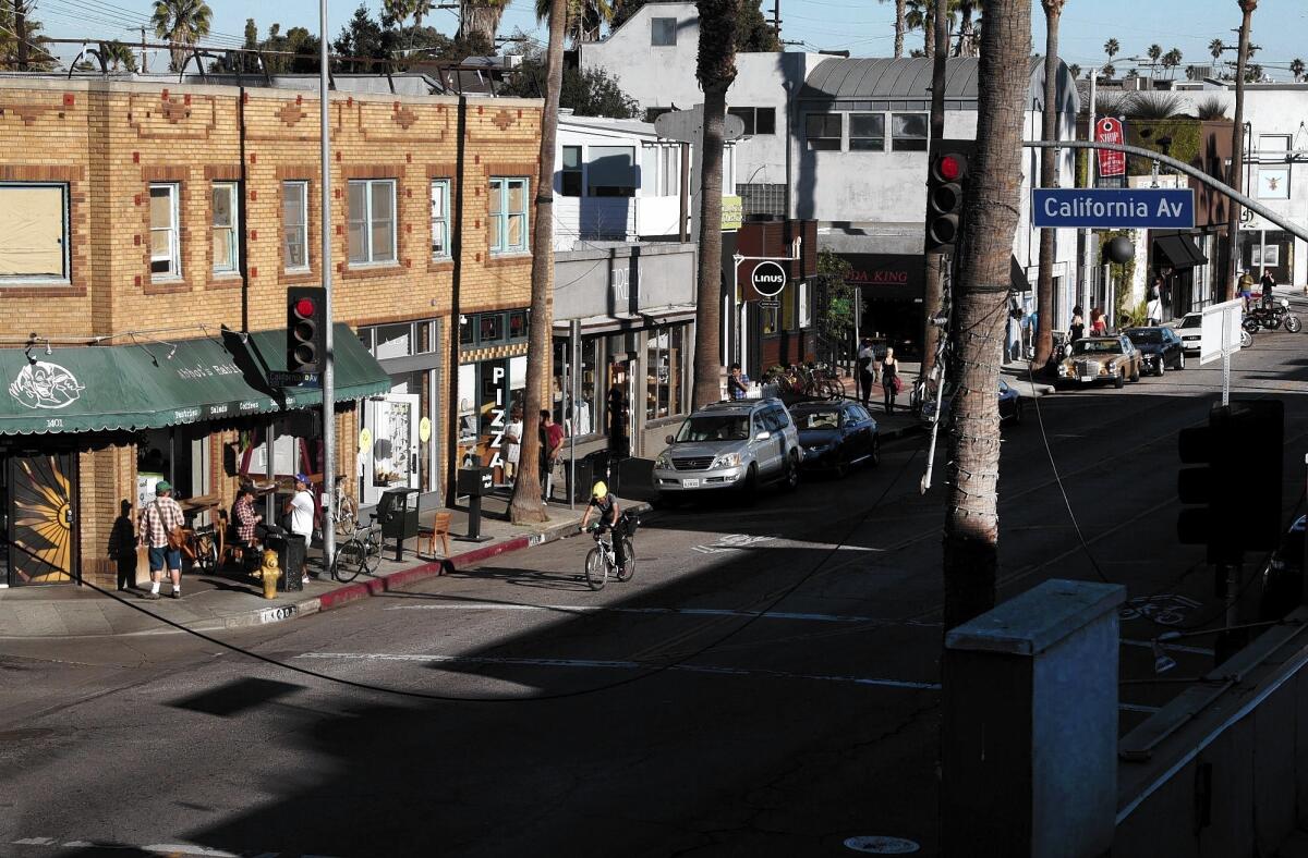 Businesses line Abbot Kinney Boulevard in Venice. Seeking to streamline the permitting process for developers and to give residents and local officials more control, the seaside community is taking its first steps toward developing a local coastal “program” or plan.