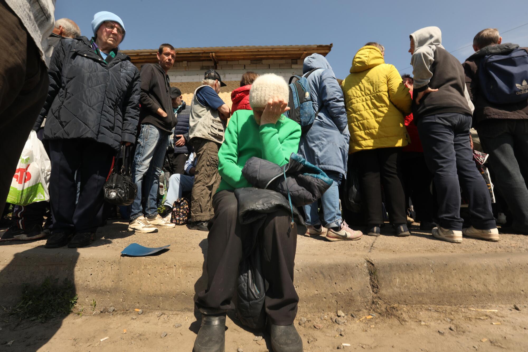 People line up to receive food assistance at Ark Church in Kharkiv, Ukraine