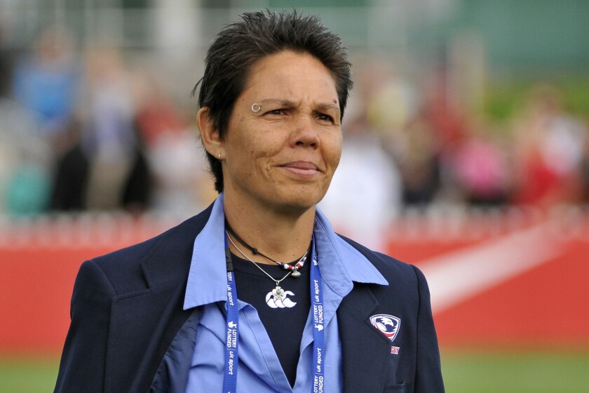 This photo provided by Bill English shows Kathy Flores, the legendary rugby player, coach and leader of the women's sport in the United States, on Aug. 28, 2010 at the Women's Rugby World Cup. Flores died of cancer in October 2021 at the age of 66 at her home in Providence, Rhode Island, according to the U.S. Women's Rugby Foundation. (Bill English via AP)