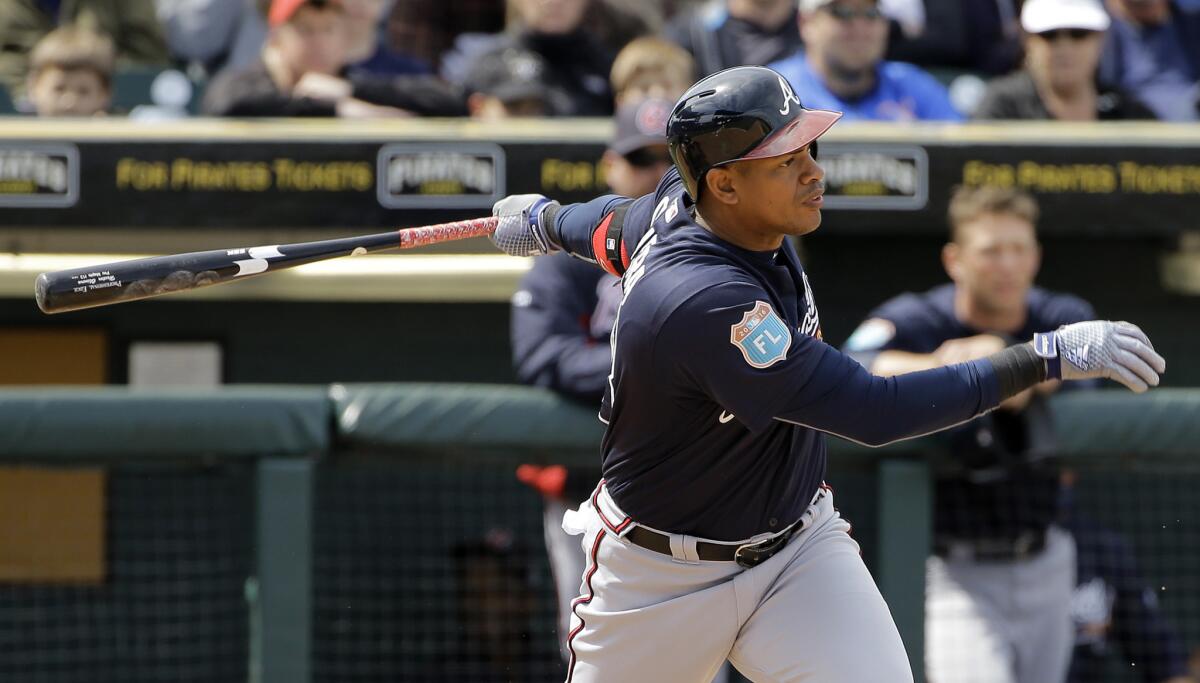 Atlanta's Hector Olivera bats against the Pittsburgh Pirates during spring training on March 21.