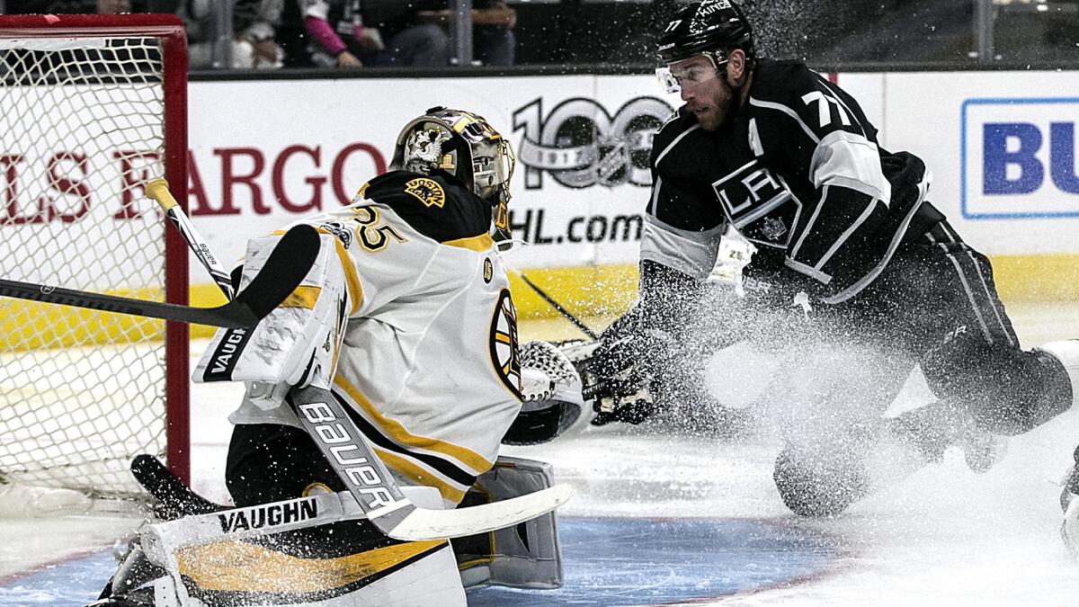 Kings center Jeff Carter stretches for the puck on a shot attempt against Bruins goalie Anton Khudobin, who made the save during the first period Thursday night.