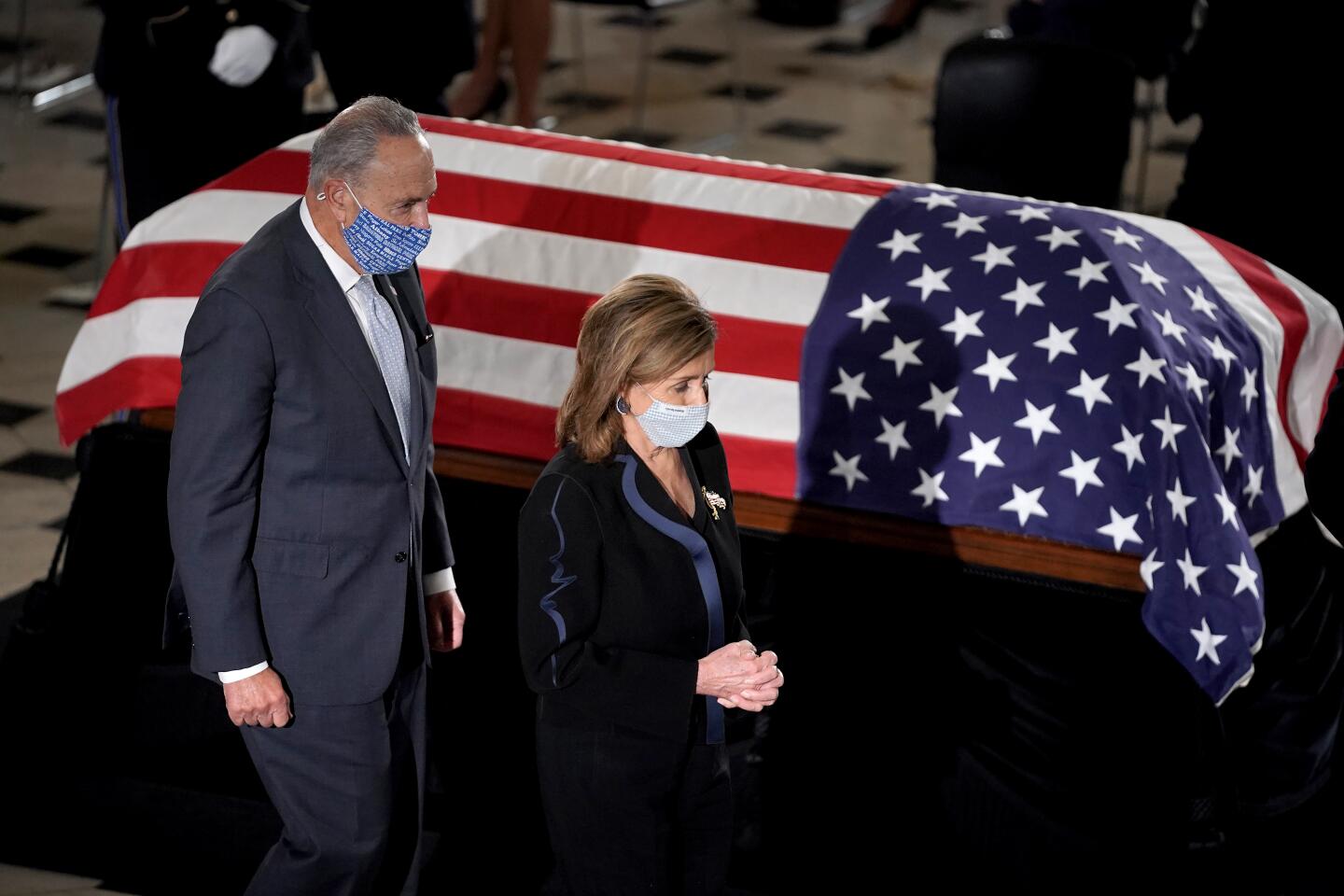 Rep. Nancy Pelosi and Sen. Charles E. Schumer pay their respects at the casket of Justice Ruth Bader Ginsburg