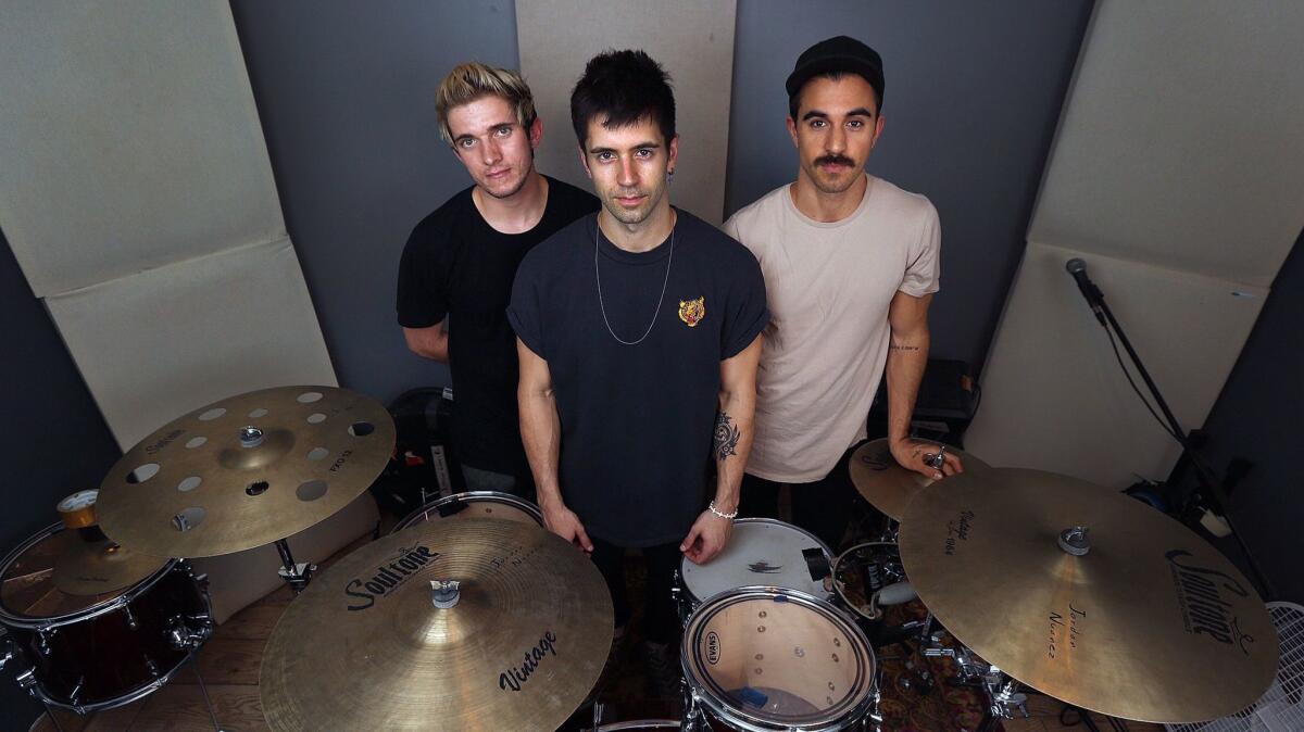 Lead singer Keith Longo, middle, with guitarist Chris Santillo, left, and drummer Jordan Nuanez, right, in their Eagle Rock studio.