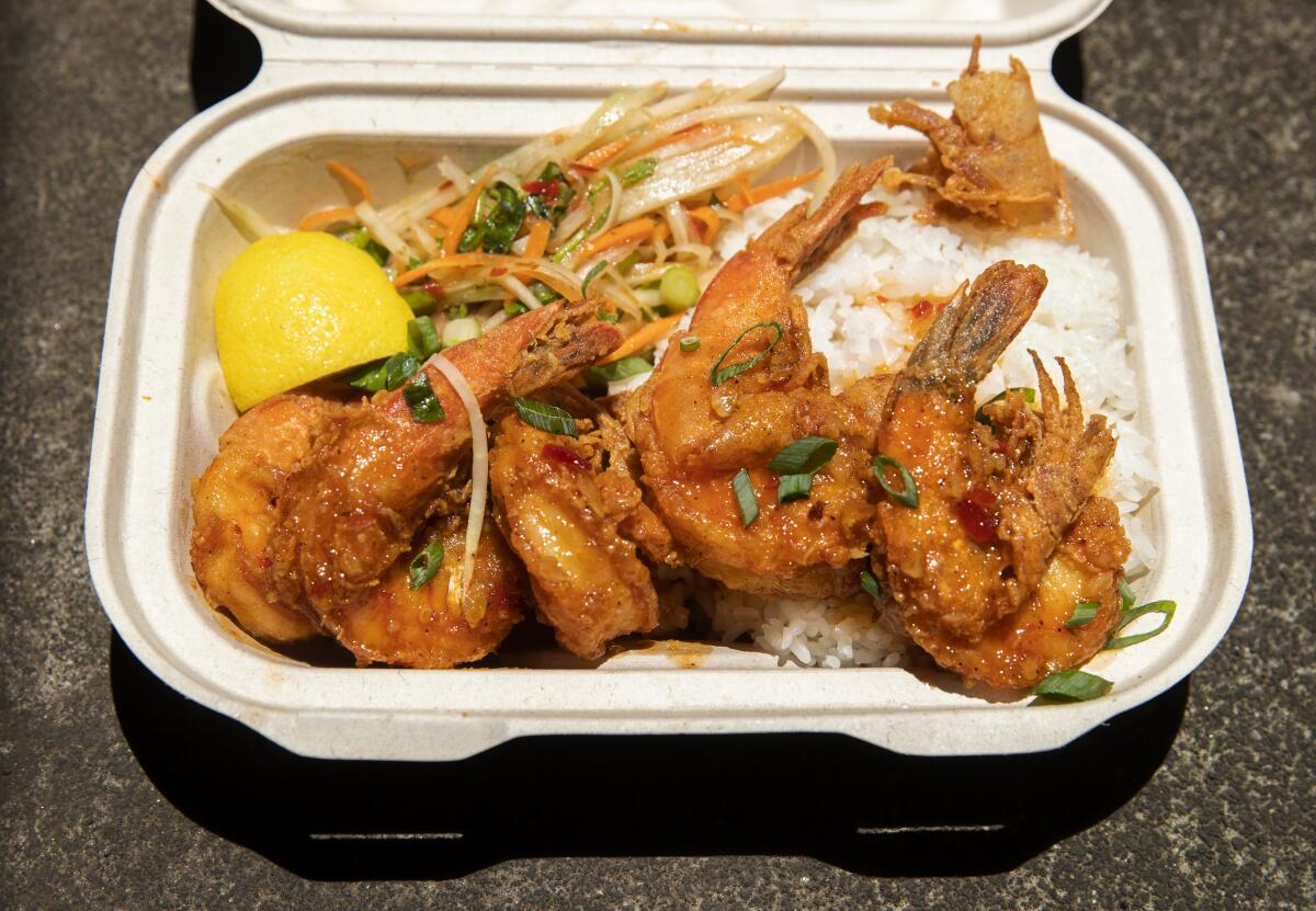 Garlic shrimp and rice is one of the specialties of the Litchon food truck at the farmers market in Hilo, Hawaii. 