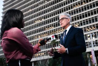 Thumbnail image is a photo of Los Angeles County district attorney George Gascon meeting with media in Grand Park on Tuesday. Select to go to story.