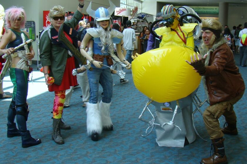 How do you navigate Comic-Con floors with six arms? Just ask Liz Ochs (center).