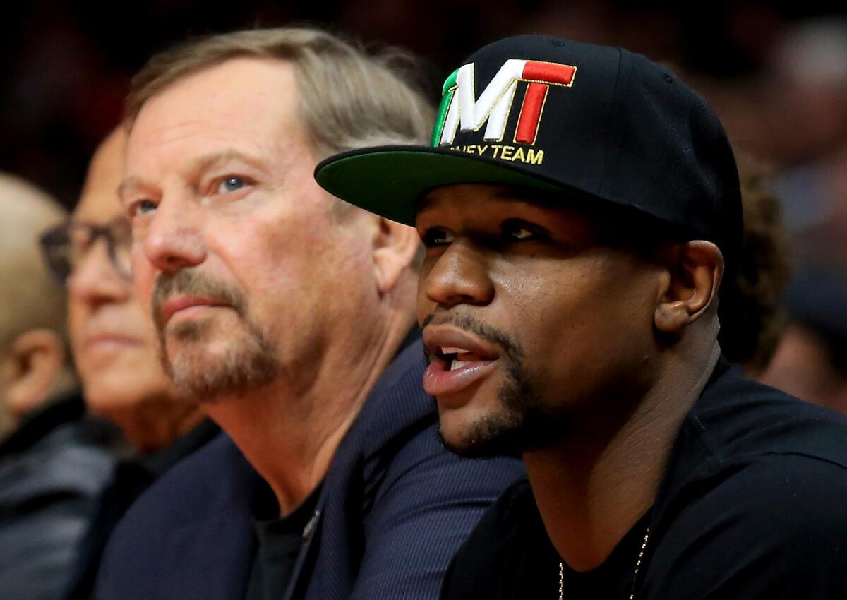 Boxing champion Floyd Mayweather Jr. watches the Clippers play the Cleveland Cavaliers on Jan. 16.