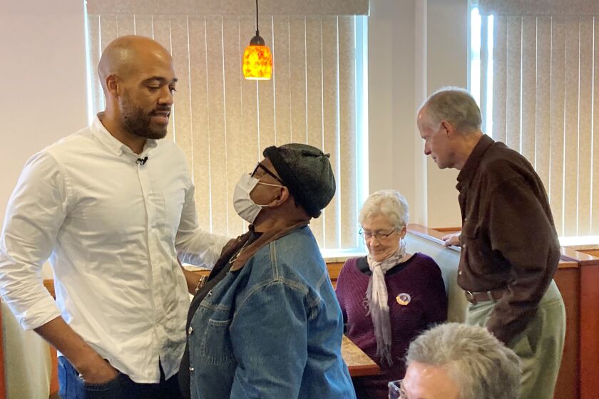 Wisconsin Democratic U.S. Senate candidate Mandela Barnes meets with older voters at Elie’s Café where he repeats his criticisms of Republican Sen. Ron Johnson for questioning guaranteed funding of Social Security and Medicare on Monday, Sept. 26, 2022, in Monona, Wisconsin. (AP Photo/Scott Bauer)