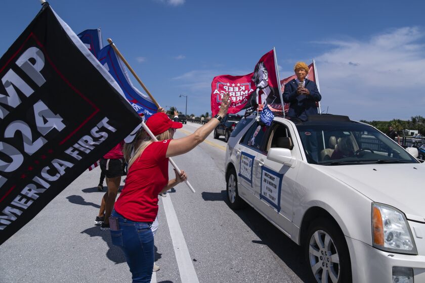 Supporters of former President Donald Trump gather outside Mar-A-Lago, Sunday, June 11, 2023, in Palm Beach, Fla. (AP Photo/Evan Vucci)