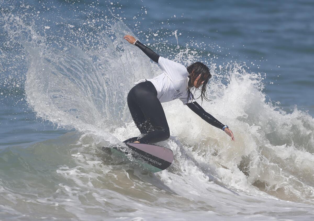 Amber Torrealba from Florida completes a backside carve as she competes in the women's pro division final of "The Vic."