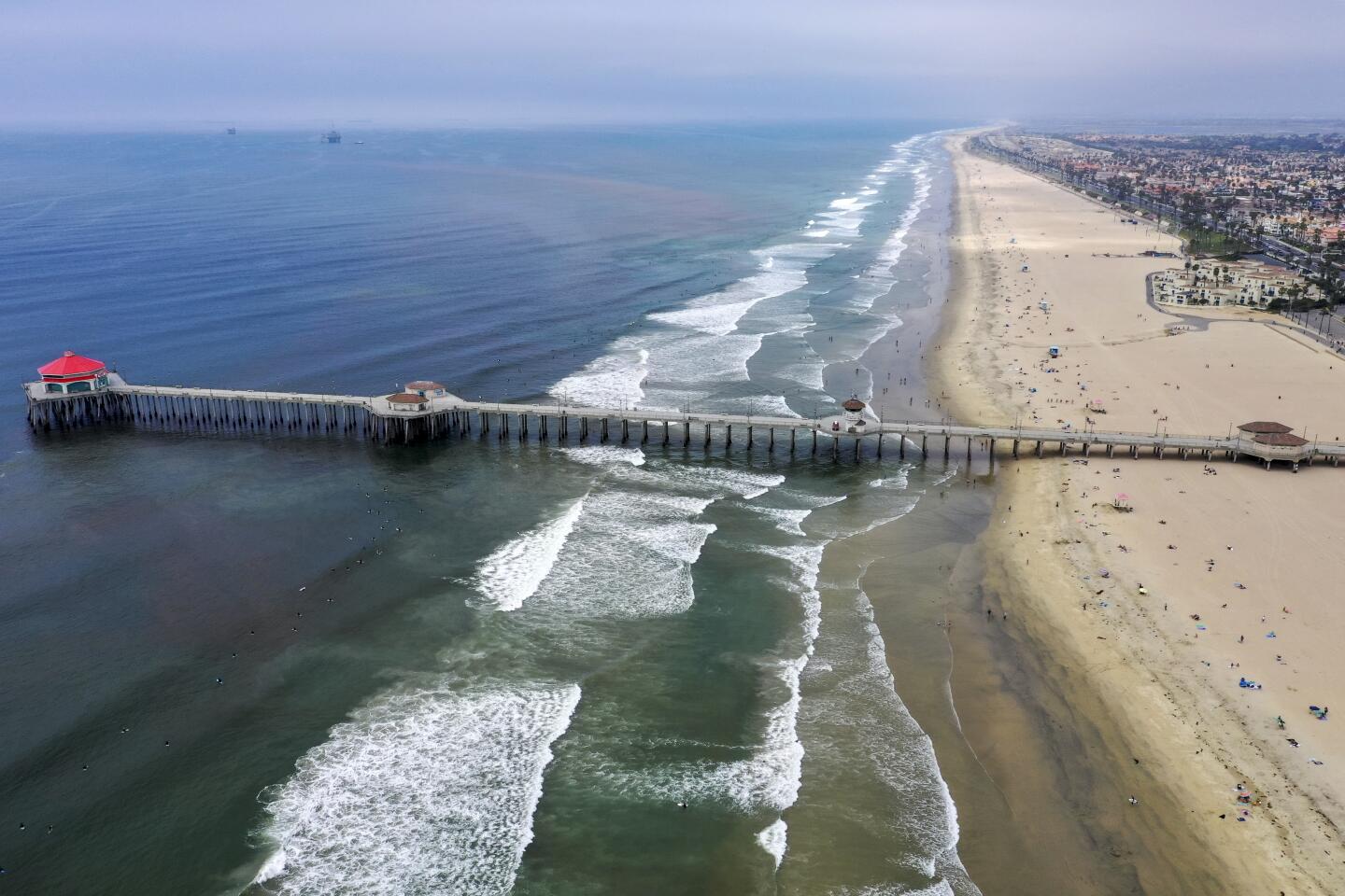 An aerial view of Huntington Beach after Gov. Newsom announced the "hard close" of all Orange County state and local beaches.