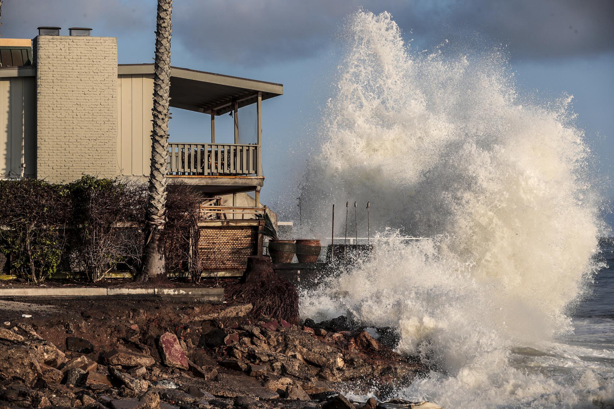 August 2021 photo of la arge wave crashing near a home in Capistrano Beach in Orange County.