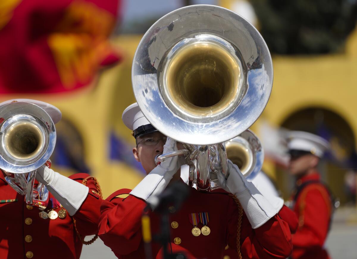 The U.S. Marine Drum & Bugle Corps plays instruments.