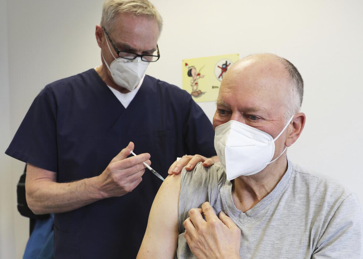 A man receives the AstraZeneca COVID-19 vaccine in Germany.