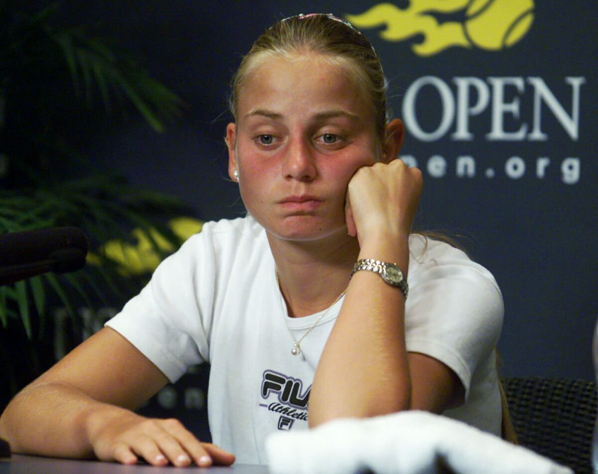 FILE - Australia's Jelena Dokic reacts during a news conference at the U.S. Open tennis tournament in New York Thursday, Aug. 31, 2000, after the completion of her singles match, the day after her father was removed from the grounds of the National Tennis Center by security, amid a stream of curses and insults, and threatened with arrest and barred from the balance of the tournament. Dokic, who was a Wimbledon semifinalist at age 17 in 2000 and reached No. 4 in the WTA rankings, wrote in an Instagram post on Monday: “Constant feelings of sadness and pain are just not going away and my life has been shattered. I blame myself, I don’t think I am worthy of loving and I am scared.”(AP Photo/Ed Betz, File)