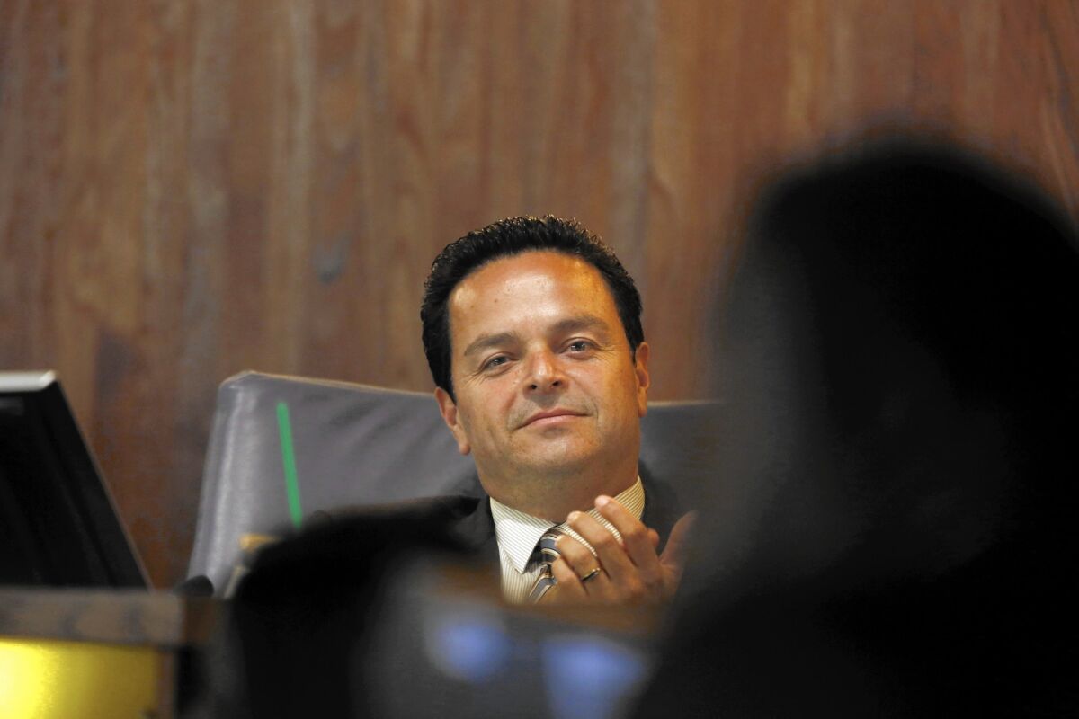 The L.A. County district attorney's office says that Albert Robles has a conflict of interest because his elected posts as Carson mayor and as a member of a water replenishment board have overlapping loyalties.