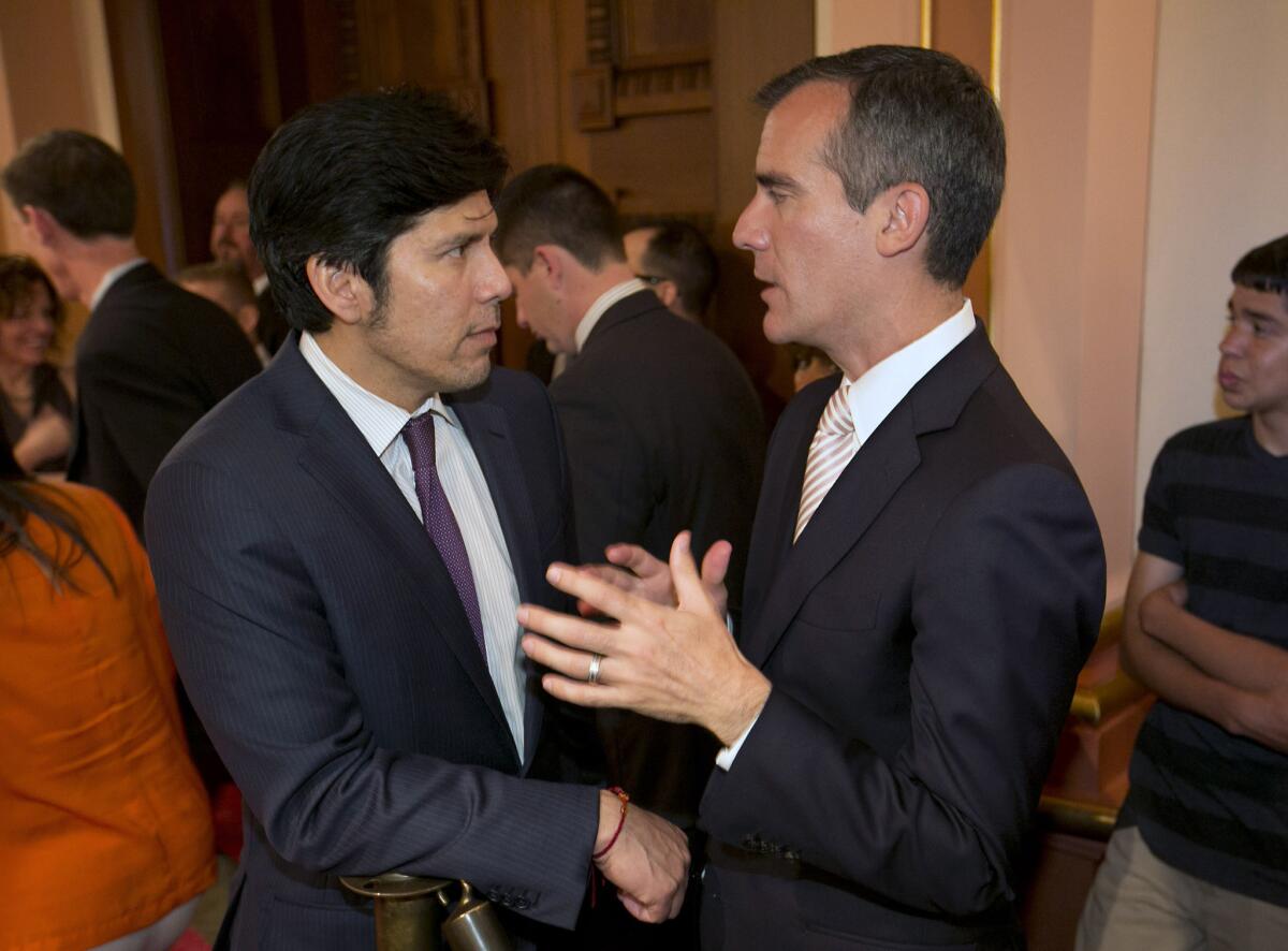 Eric Garcetti, right, and Sen. Kevin de Leon, D-Los Angeles, talk during the L.A. mayor's first official visit to the Capitol in Sacramento on June 5.