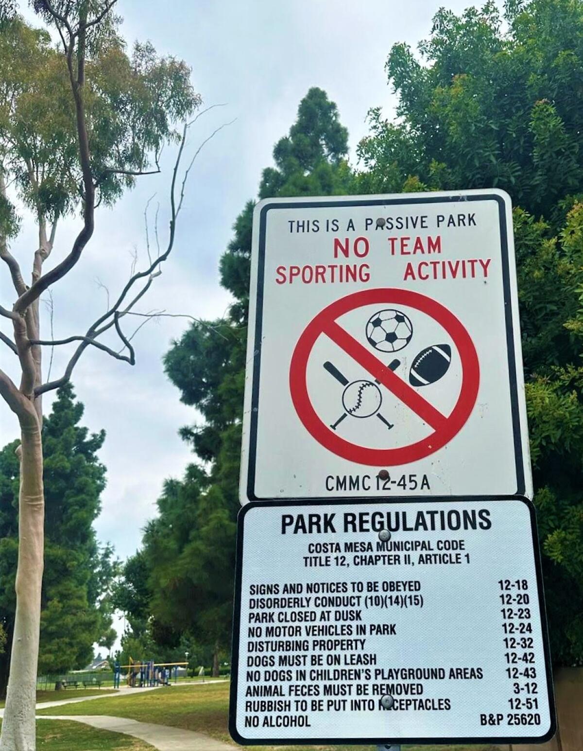 A sign at Costa Mesa's Paularino Park declares the spot's passive use under the city's municipal code.