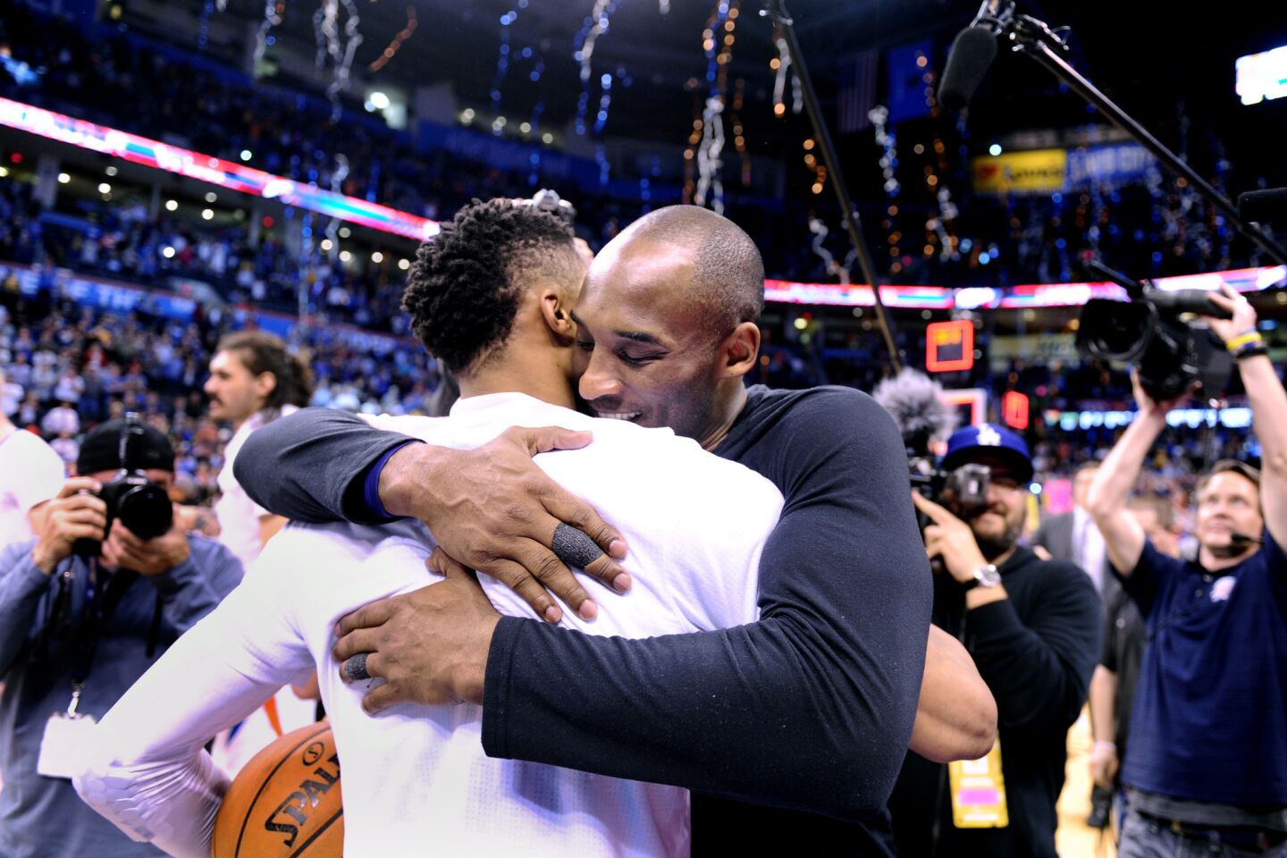 Kobe Bryant hugs the Thunder's Russell Westbrook after a game in Oklahoma City on April 11.