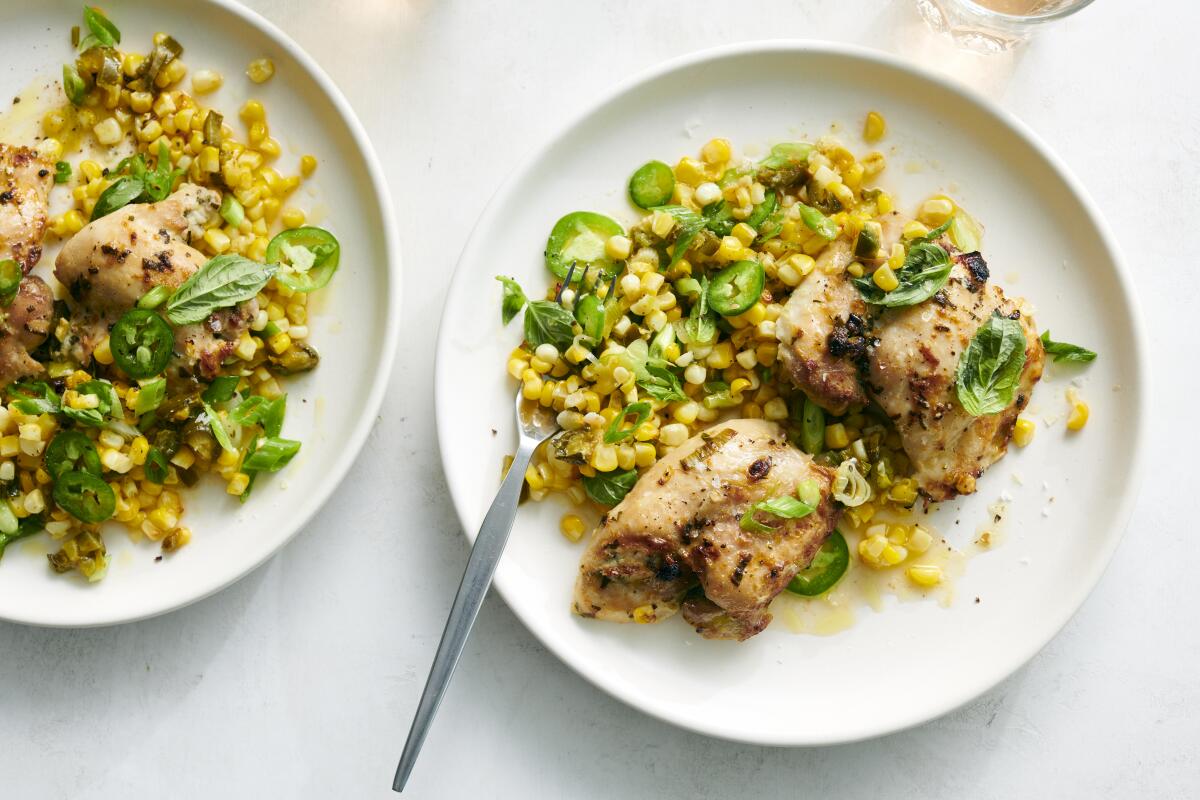 Sheet-pan chicken thighs with spicy corn.