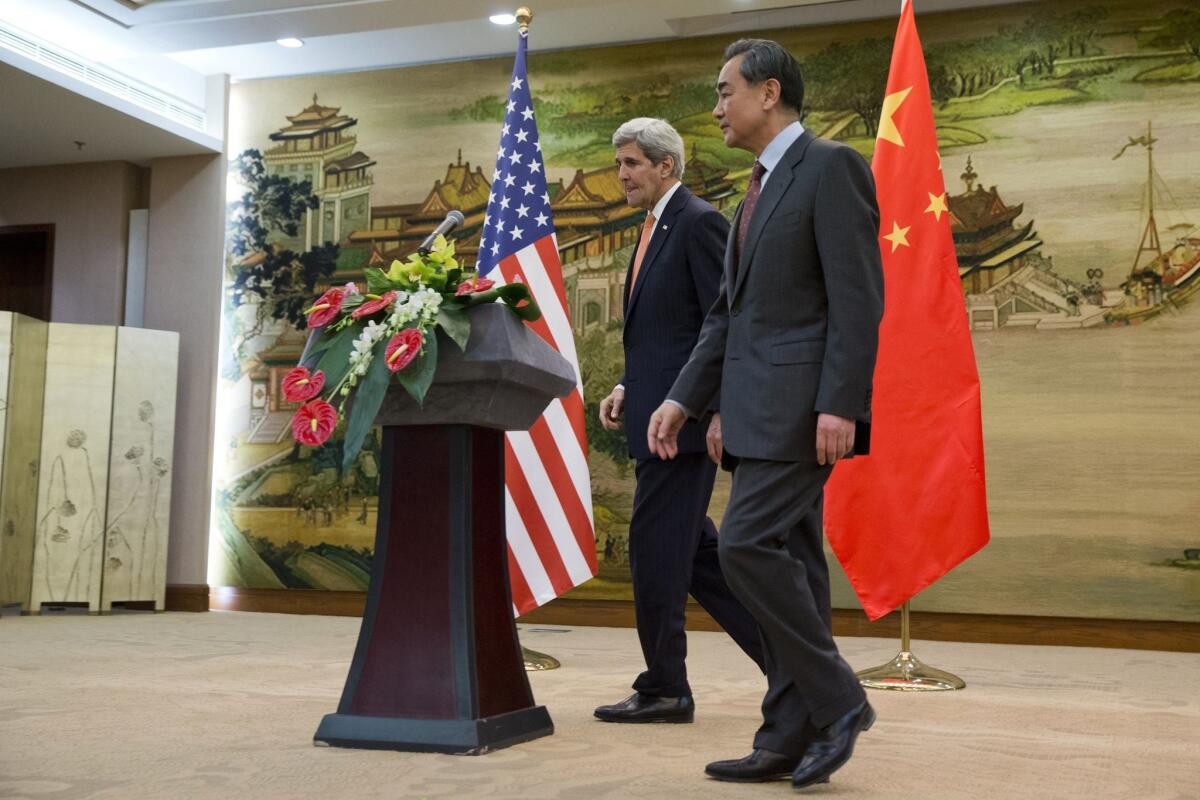 US Secretary of State John Kerry leaves a news conference with Chinese Foreign Minister Wang Yi at the Ministry of Foreign Affairs in Beijing on January 27, 2016.