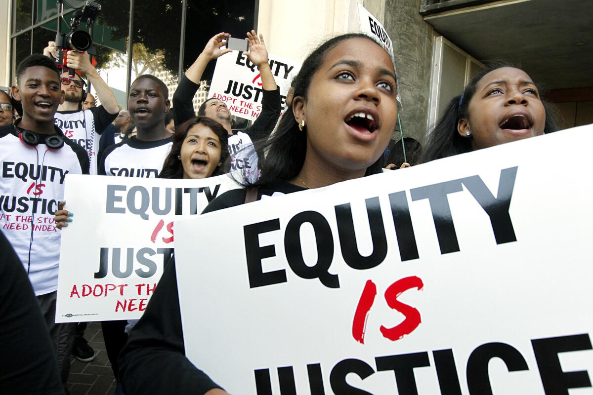 Activists urge the L.A. Unified Board of Education to pass the "Equity is Justice Resolution"--which would send millions of dollars in new education funds to the highest-need schools.