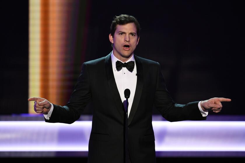 Ashton Kutcher speaks onstage during the 23rd Screen Actors Guild Awards at the Shrine Auditorium.