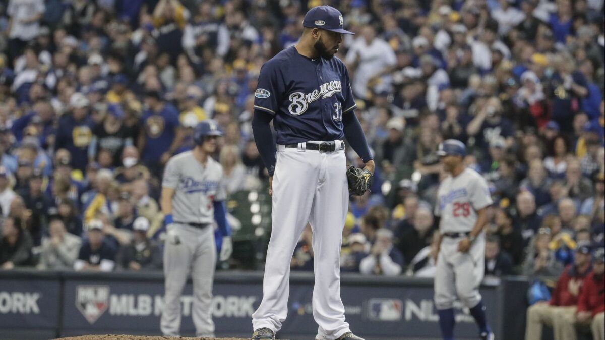 Milwaukee Brewers reliever Jeremy Jeffress pitches in the seventh inning of Game 2 of the National League Championship Series at Miller Park on Saturday.