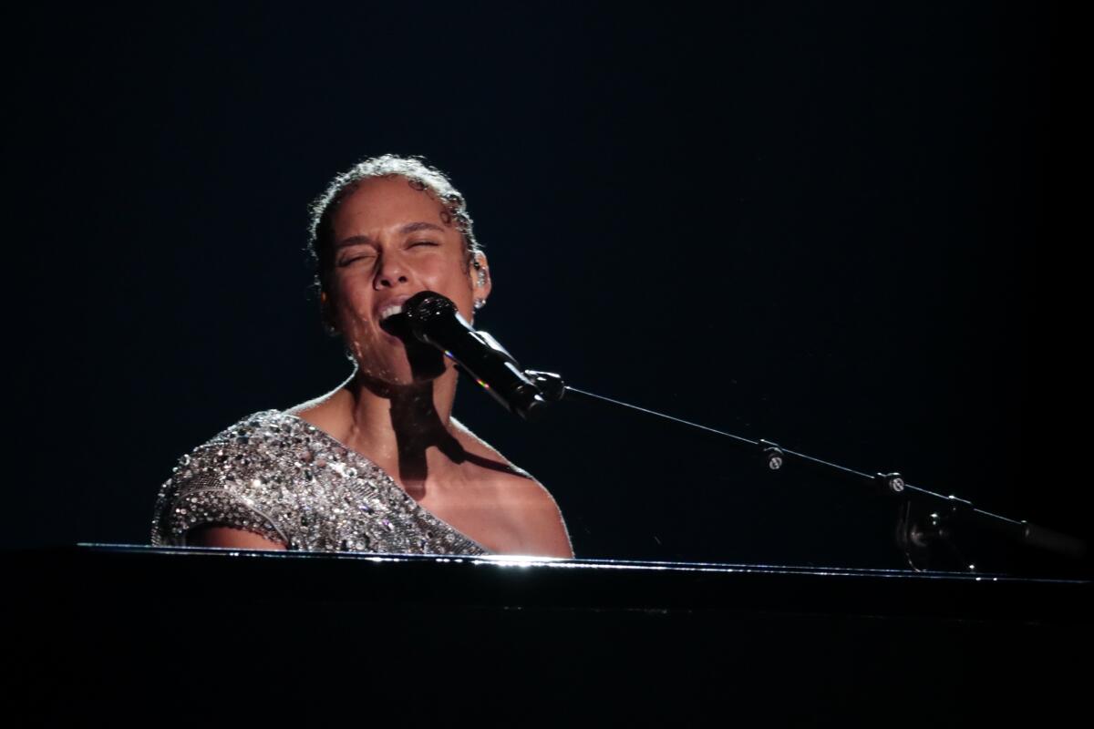 Host Alicia Keys performs at the 62nd Grammy Awards